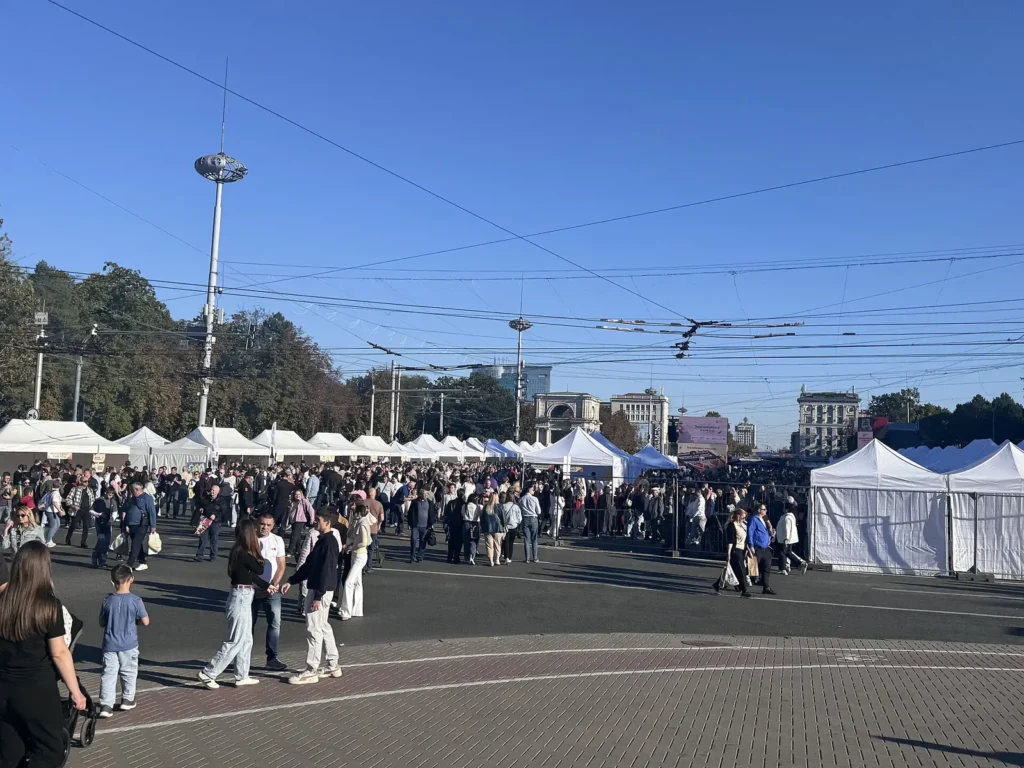 Crowds and white winery tents on Great National Assembly Square in Chișinău during Wine Day 2026