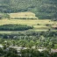 Rolling countryside in Hîncești District, Moldova, with fields, orchards and a village